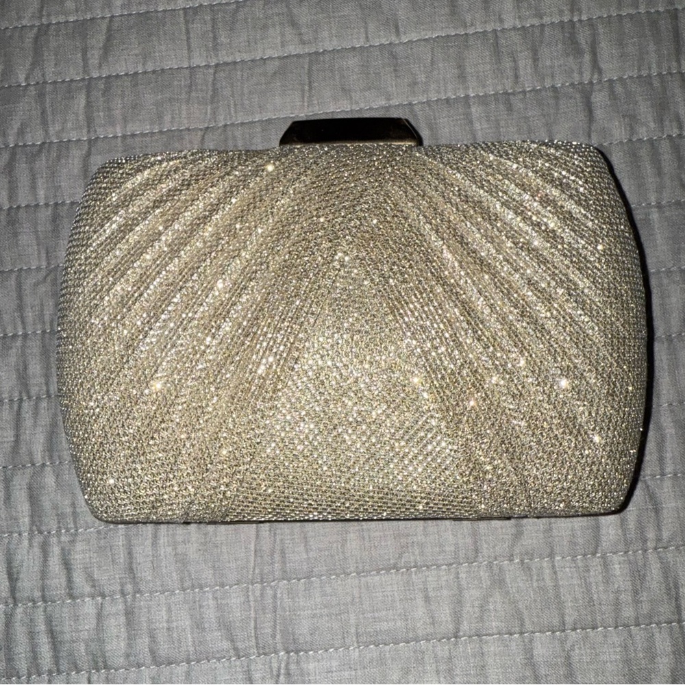 Rose gold shimmery clutch with optional straps, great for evening wear.